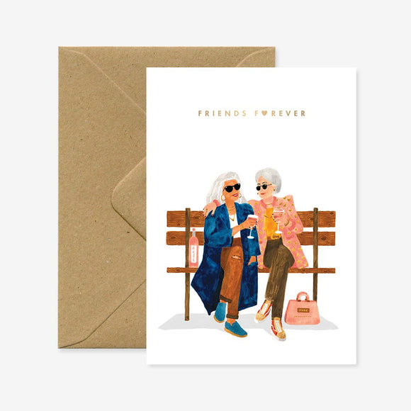 Friends Forever greeting card by All the Ways to Say – illustrated card featuring two stylish elderly women sitting on a bench, drinking wine, with gold foil text.