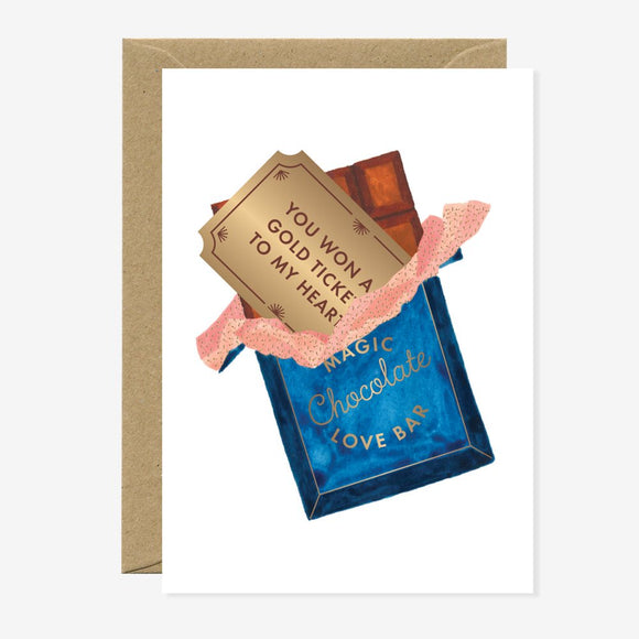 A greeting card with an illustration of a chocolate bar and a golden ticket. The text on the ticket reads 'You won a golden ticket to my heart.