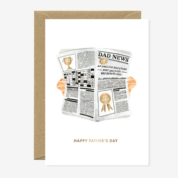 Greeting card with a newspaper titled “Dad News” declaring “Best Dad Ever”, with crossword puzzle and gold medal illustrations, held by two hands.