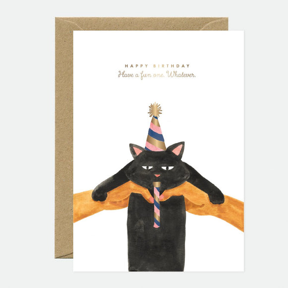 A birthday greeting card featuring a black cat with a party hat, accompanied by a brown envelope.