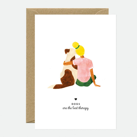 A greeting card depicting a stylized illustration of a person hugging a dog with the text 'DOGS ARE THE BEST THERAPY' and a brown envelope.