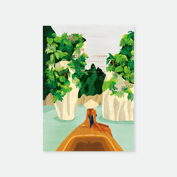Bay Notebook A5 – illustrated cover with boat, tropical cliffs, lush greenery, and contemplative figure, gold foil details, by All the Ways to Say.