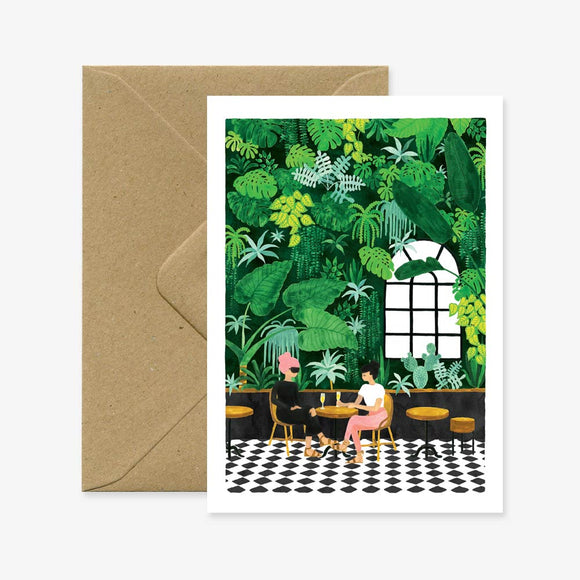 A greeting card with an illustration of a person sitting in a room filled with green plants, accompanied by a brown envelope.