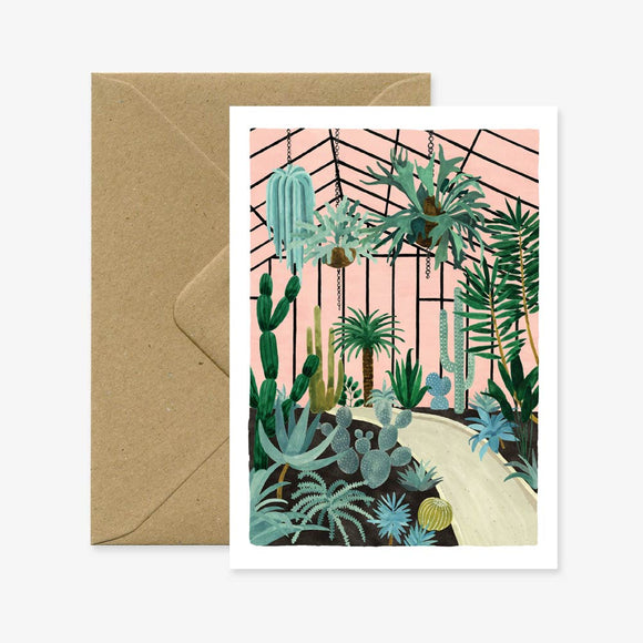 A greeting card with an illustration of various plants in a conservatory, accompanied by a brown envelope.