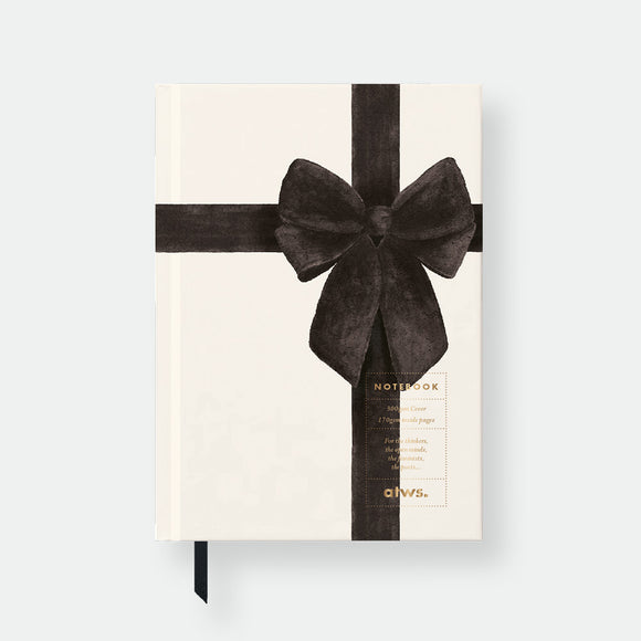 Hardcover notebook A5 with cream cover, black velvet bow illustration, gold foil details and black ribbon bookmark by All the Ways to Say.