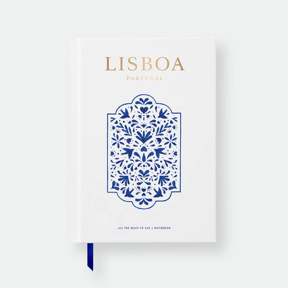 Hardcover notebook A5 with white cover, blue azulejo-inspired motif, gold foil “Lisboa” title and ribbon bookmark by All the Ways to Say.