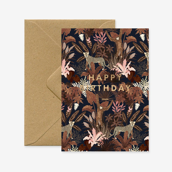 A birthday greeting card with a floral and animal pattern, featuring gold foil details, and the text 'Happy Birthday'. There is a recycled brown A6 envelope included.