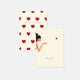Two pocket notebooks, one with a gold foil heart pattern and the name Bisou, and another with an illustration of a person holding a notebook with the text 'Passion cute notebook'.