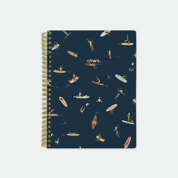 Paddle Girls Spiral Notebook – navy blue cover with playful paddleboarding and surfing illustrations, gold foil details, by All the Ways to Say.