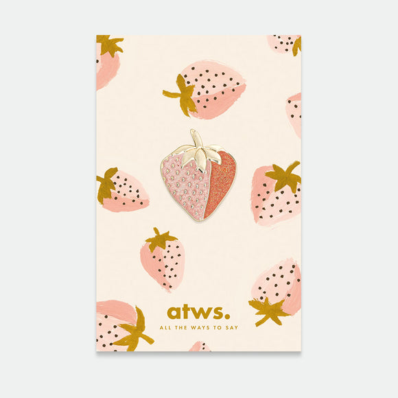 A pack of pins with a gold plating and pink enamel design shaped like strawberries, presented on a card with the brand name 'atws.'.