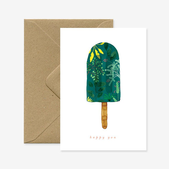 A greeting card with a floral popsicle design on the front and a brown envelope included. The card has a 'happy you' text on it.