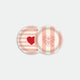 Round coaster tray with pink striped background featuring red heart and floral heart illustrations, made of birch wood