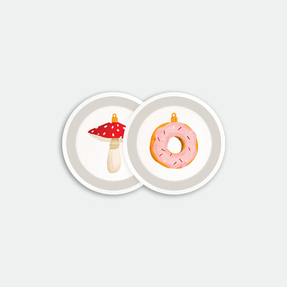Round coaster tray with pink frosted donut and red mushroom ornament illustrations on white background, birch wood material