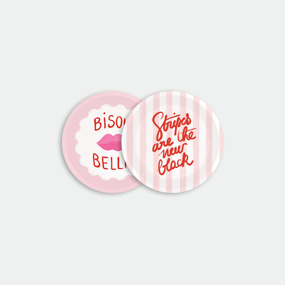 Set of two round coasters, one with pink lips and “Bisou Bella” text, the other with pink stripes and lettering, Bisou Bella by All the Ways to Say