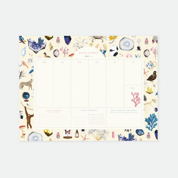 A weekly planner with a white background featuring colorful illustrations of plants and animals along the borders.