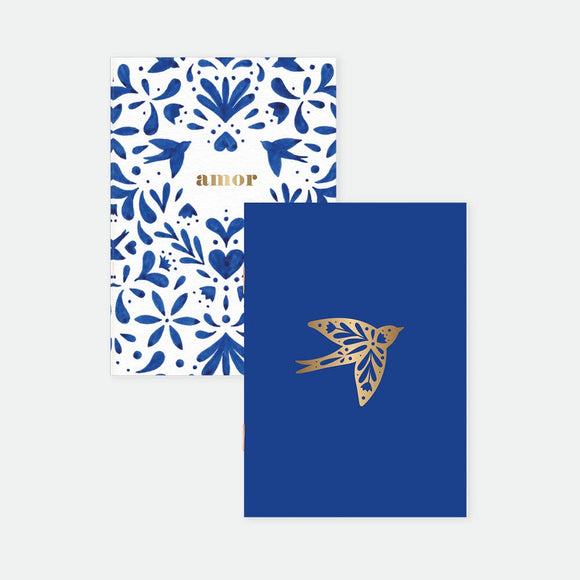 Swallows Pocket Notebook A6 Duo – illustrated covers with blue folk patterns and golden swallow design, gold foil details, by All the Ways to Say.