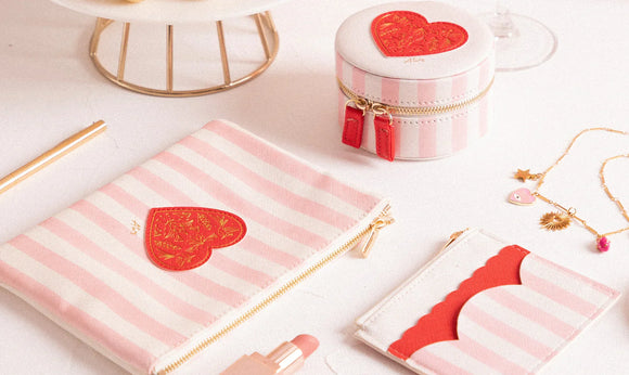All the Ways to Say bags and accessories – pink striped pouches and jewelry cases with red heart design