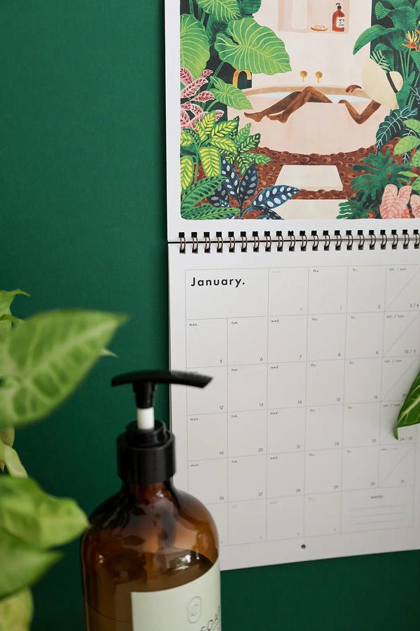 Detail of January illustration from Travel Bucket List 2026 calendar – lush greenery and serene bath