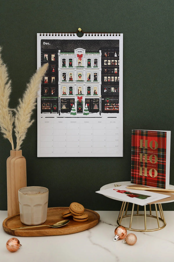 December page of Daily Poetry 2026 calendar – festive street with decorated shop windows