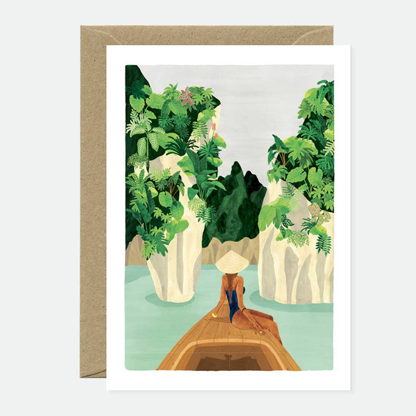 Greeting card with an illustration of a natural scene, featuring a body of water with green plants and a person in a boat. The card has a blank interior and comes with a brown envelope.