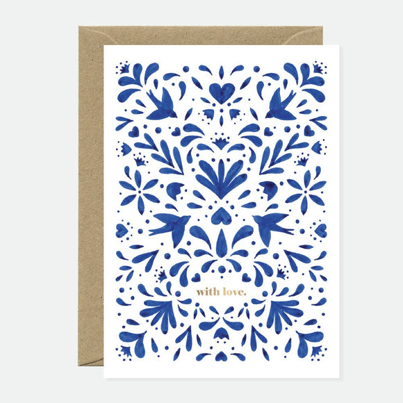 A blue greeting card with gold foil details and a floral pattern, sent with a recycled brown envelope.