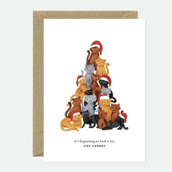 Greeting card with an illustration of cats wearing Santa hats in a pyramid shape, and text that reads 'It's beginning to look a lot like Catmas'.