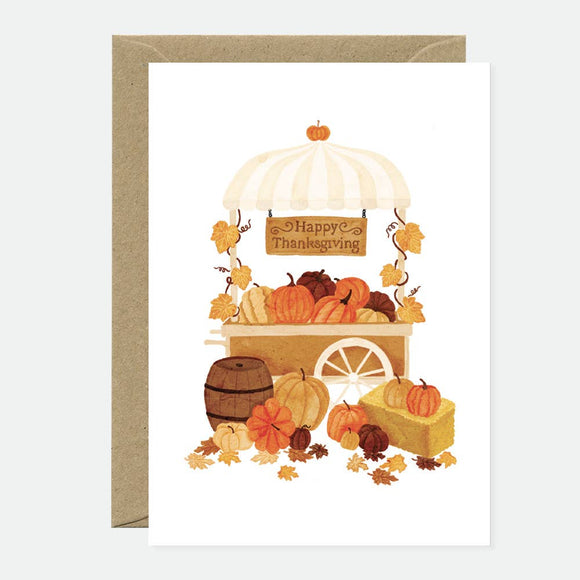 Greeting card with a thanksgiving theme, featuring an illustration of a turkey, pumpkins, and fall-themed textiles in a brown and white color scheme.