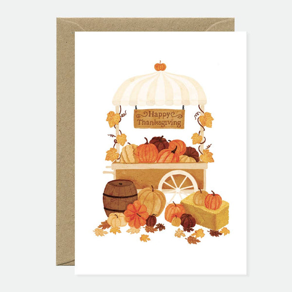 Greeting card with a thanksgiving theme, featuring an illustration of a turkey, pumpkins, and fall-themed textiles in a brown and white color scheme.