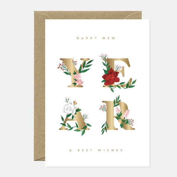 A New Year greeting card with the word "YEAR" in bold gold foil letters decorated with red, pink, and white flowers and green leaves.