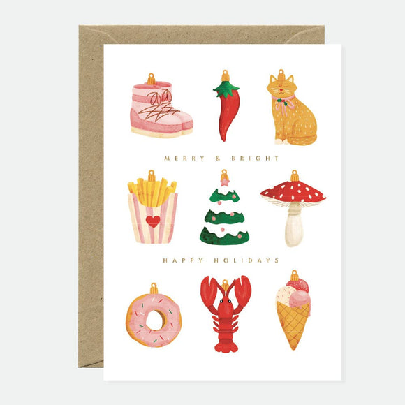 A greeting card with a variety of illustrated holiday ornaments, such as a Christmas tree, a mushroom, an ice cream cone, and an envelope, with gold foil details.