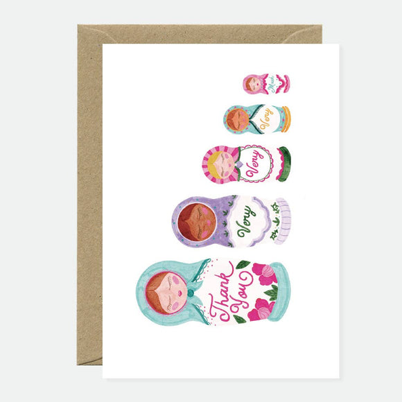 Illustration of colorful Russian nesting dolls, each smaller doll opening to reveal words forming the phrase “Thank you very much.”