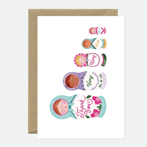 Illustration of colorful Russian nesting dolls, each smaller doll opening to reveal words forming the phrase “Thank you very much.”