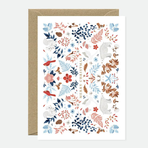 Greeting card with a winter-themed floral and animal pattern, including berries, flowers and polar bears, decorated with gold foil and “Merry Christmas” text.