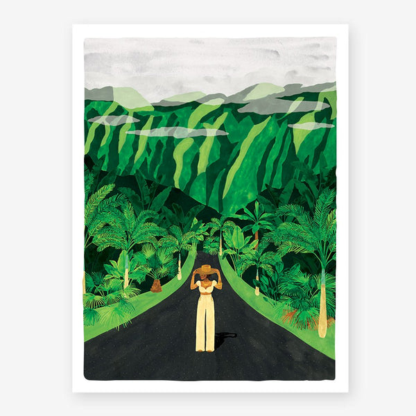 Hawaï art print showing a woman in cream trousers and a straw hat on a road surrounded by palm trees and lush green mountains.