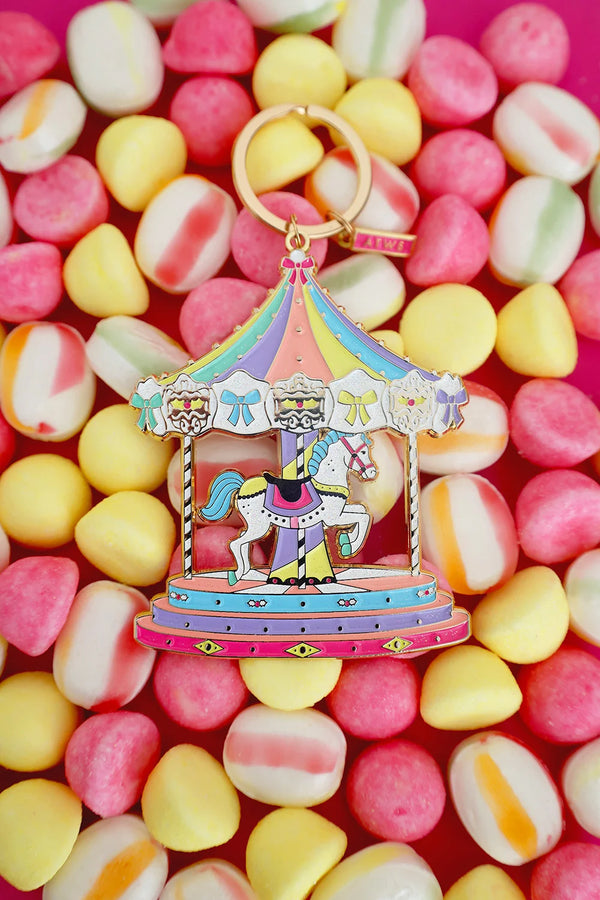 Merry Go Round keychain by All The Ways To Say on colorful candy background – pastel enamel carousel design