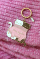 Close-up of 2 Cats in a Sweater keychain – enamel charm featuring two cats sharing a pink glitter sweater
