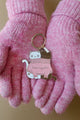 2 Cats in a Sweater keychain held in pink wool gloves – cozy winter accessory by All The Ways To Say