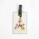 Illustrated luggage tag with a traveler walking two dogs, Madame Voyage design by All The Ways To Say.