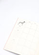 Inside page of Dogue monthly planner featuring a Dalmatian illustration with calendar layout