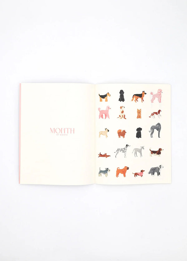 Dogue monthly planner open spread with colorful dog illustrations and “Month by Month” title