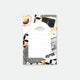 A multicolor floral-patterned notepad with a black and white grid design and text '50 pages' on the cover.
