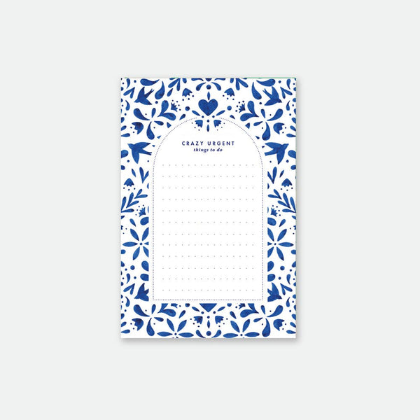 Swallows Notepad by All the Ways to Say featuring elegant blue swallow and floral motifs on white background, A6 size (10.5 x 15.7 cm), 50 pages.