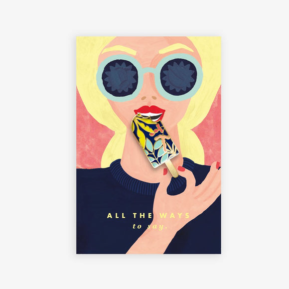 Popsicle enamel pin by All the Ways to Say featuring a colorful ice cream design with gold-plated details on illustrated retro woman background.