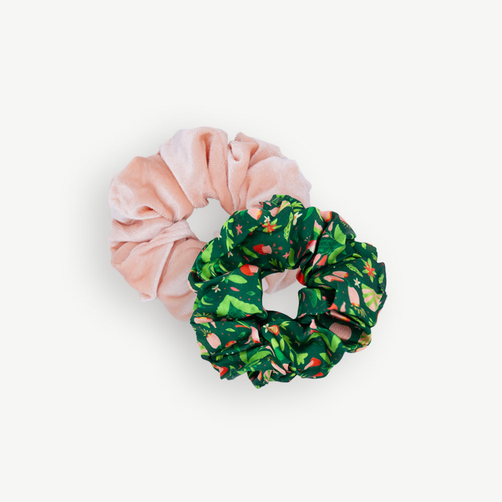 Green Jungle scrunchie duo by All the Ways to Say featuring pink velvet and tropical green leaf pattern scrunchies, made from 100% recycled polyester.