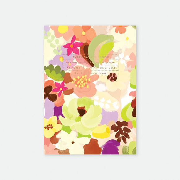 A5 notebook cover by All The Ways To Say featuring a lush and colorful watercolor floral pattern in shades of pink, yellow, and purple.
