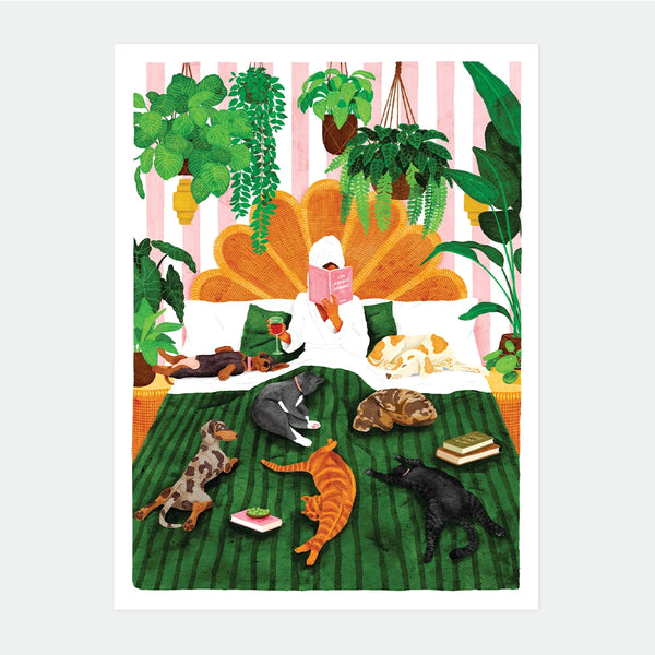 A cozy watercolor poster by All The Ways To Say showing a person reading in bed surrounded by many dogs, cats, and lush hanging plants.