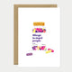 A humorous greeting card by All The Ways To Say featuring a watercolor jar of colorful "anti-idiot" pills with the text "Allergic to stupid people."