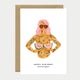 A bold greeting card by All The Ways To Say featuring a watercolor illustration of a tattooed woman with pink hair holding watermelon slices with the text "HAPPY BIRTHDAY summer queen".