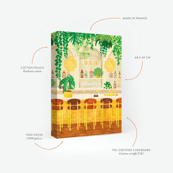Product features of the Green Bar 1000-piece jigsaw puzzle by All the Ways to Say. Highlights: Made in France, FSC-certified cardboard, and cotton pouch. The illustration shows a stylish bar interior with lush hanging plants, golden stools, and curated spirit bottles.