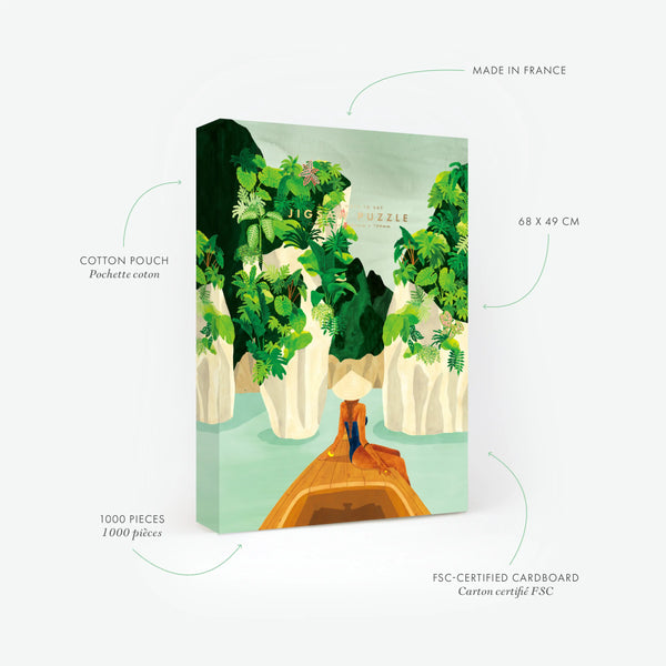 Technical details of the Ha Long Bay 1000-piece jigsaw puzzle. Features include 68x49 cm size, FSC cardboard, and French manufacturing. The hand-painted illustration depicts a serene boat journey through limestone cliffs and emerald waters.
